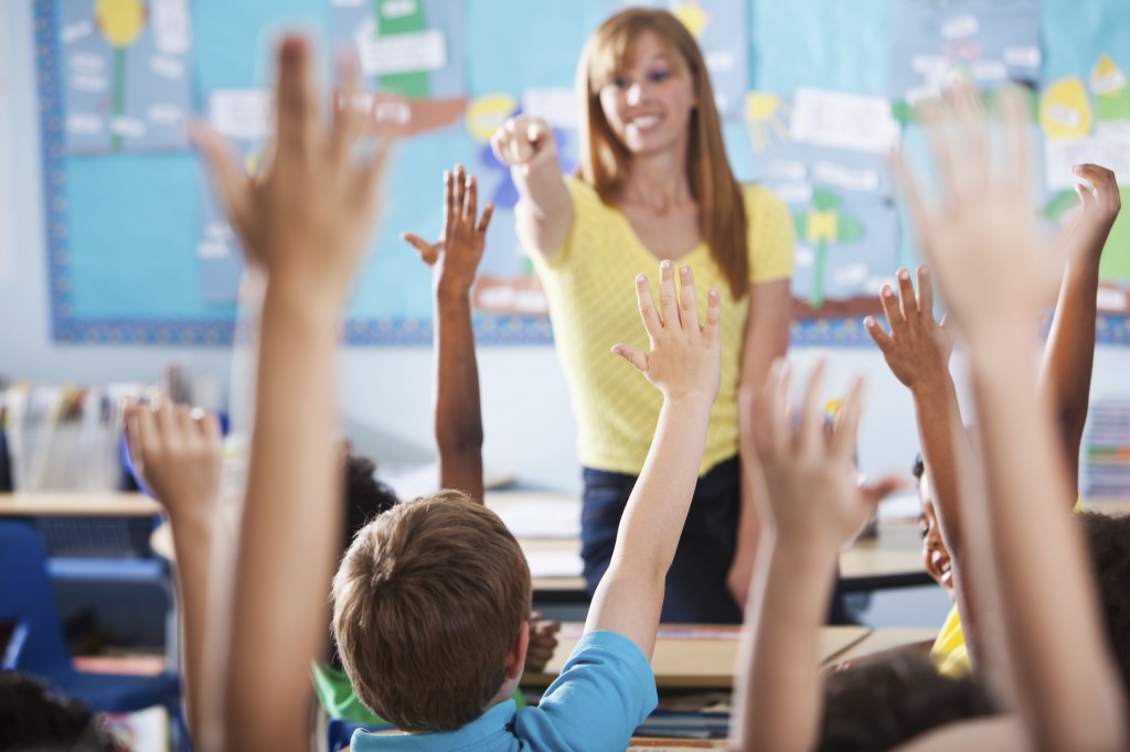 Elementary school class, raising hands Teaching Agencies Blackpool Tower Supply